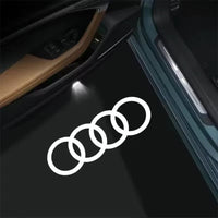 Projecteur logo porte voiture Audi Blanc - vue de face - Becquet Voiture