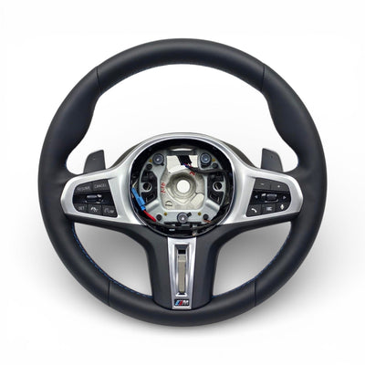 https://cdn.shopify.com/s/files/1/0565/4957/2747/files/volant_bmw_g20_noir_cuir_1_1.jpg?v=1772897441