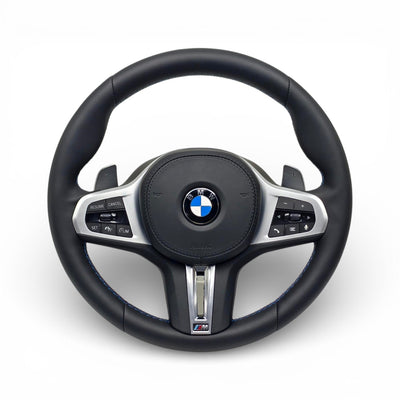 https://cdn.shopify.com/s/files/1/0565/4957/2747/files/volant_bmw_g20_noir_cuir_2_1.jpg?v=1772897441