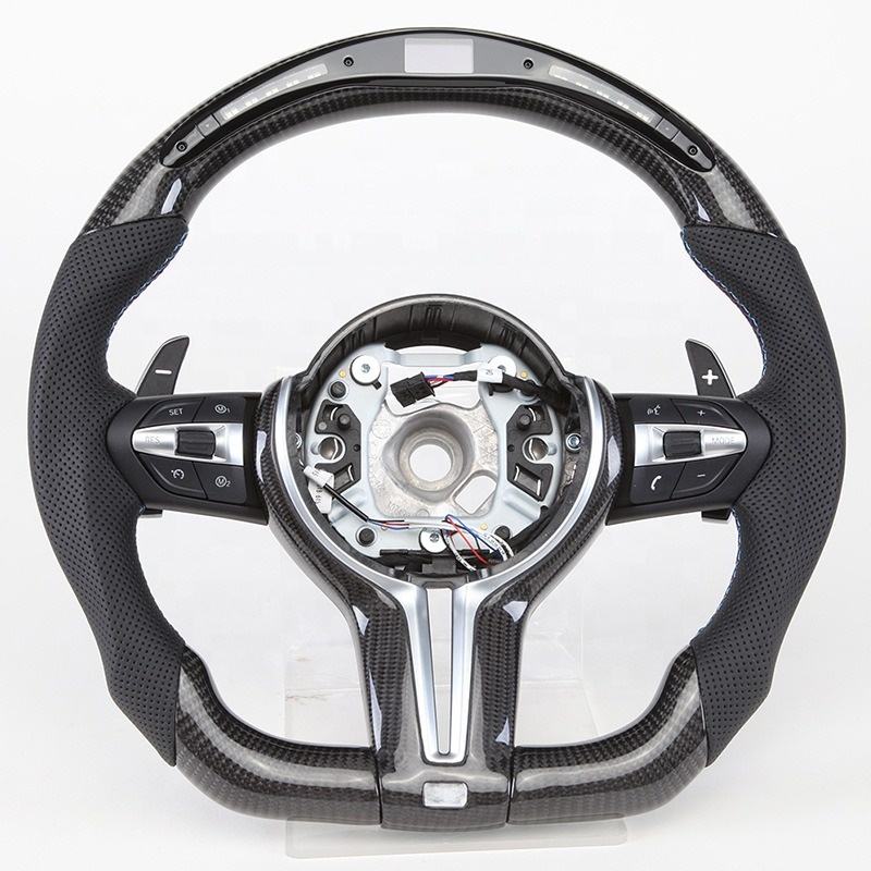 https://cdn.shopify.com/s/files/1/0565/4957/2747/files/volant_bmw_pack_m-forme_performance_-_carbone_haut_bas_-_carbone_centre_-_LED_-_cuir_perfore_-_palettes_-_logo_-_coutures_M.jpg?v=1772905313
