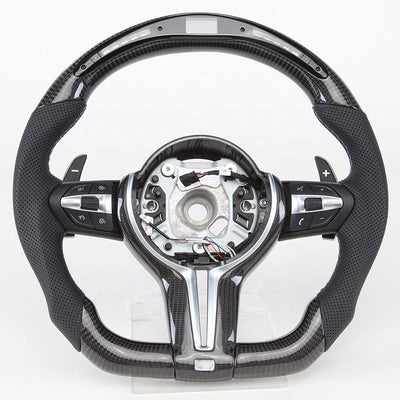 https://cdn.shopify.com/s/files/1/0565/4957/2747/files/volant_bmw_pack_m-forme_performance_-_carbone_haut_bas_-_carbone_centre_-_LED_-_cuir_perfore_-_palettes_-_logo_-_coutures_M.jpg?v=1772905313