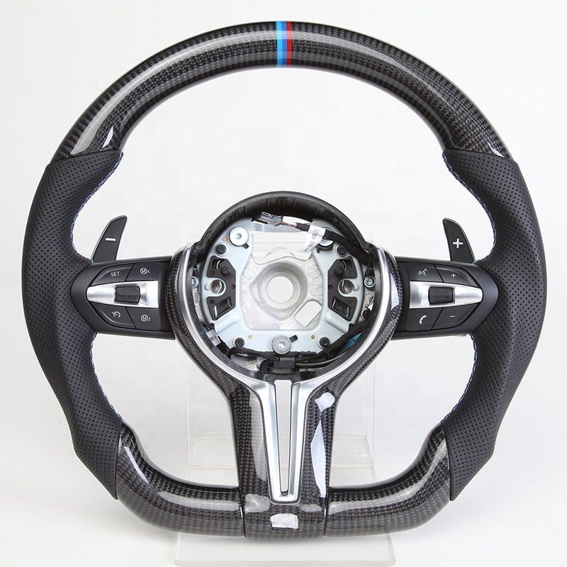 https://cdn.shopify.com/s/files/1/0565/4957/2747/files/volant_bmw_pack_m-forme_performance_-_carbone_haut_bas_-_carbone_centre_-_indice_12h_M_-_cuir_perfore_-_palettes_-_logo_-_coutures_M.jpg?v=1772905313